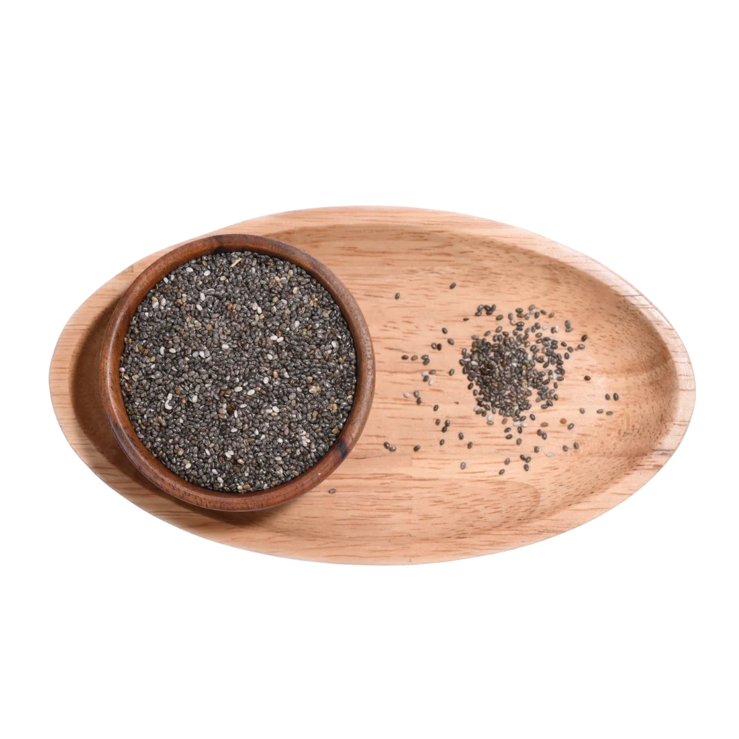 Wooden bowl with chia seeds on a wooden tray