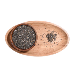 Wooden bowl with chia seeds on a wooden tray