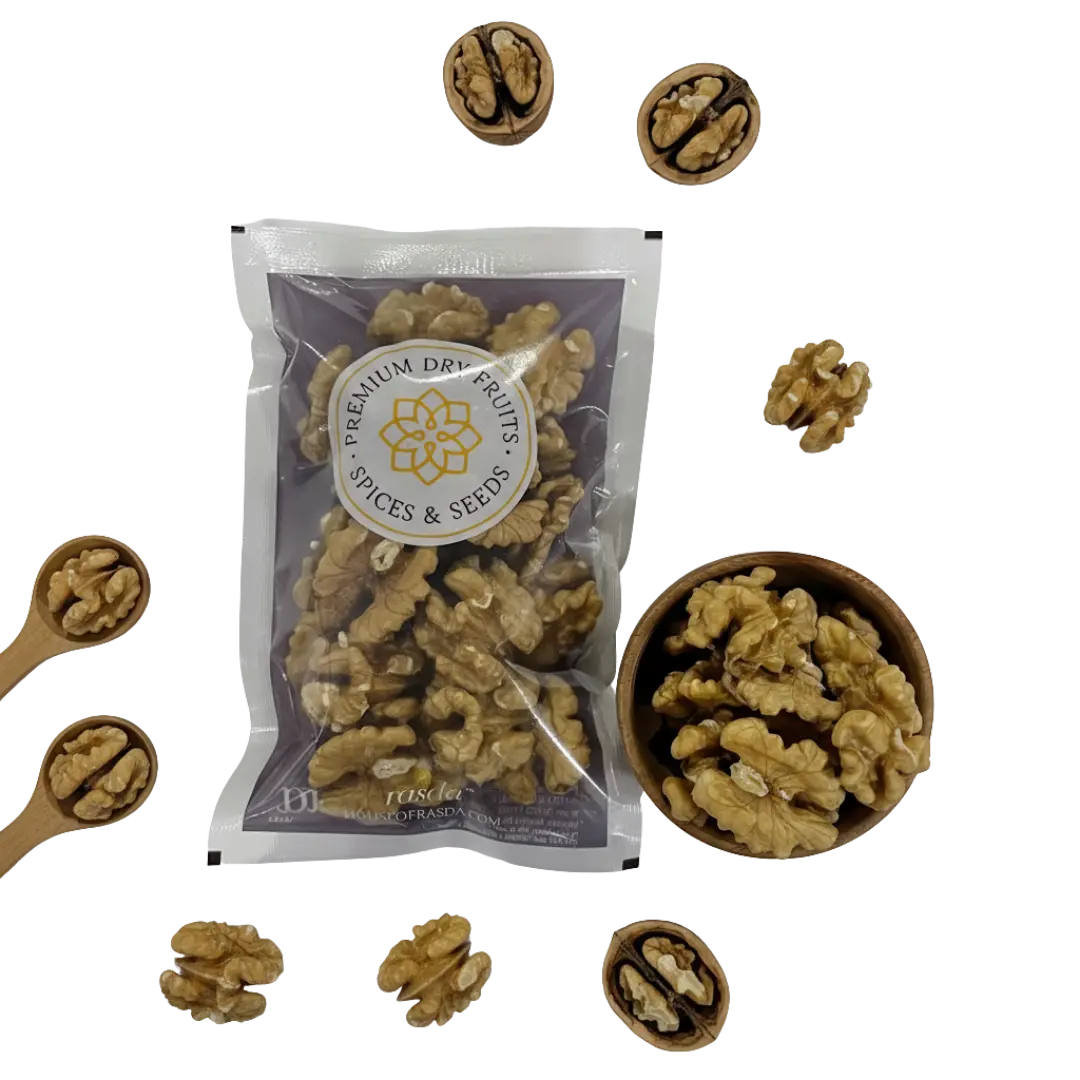 Premium Chilean walnuts (Akhrot) halves pack with wooden bowl and scattered walnut kernels on black background.