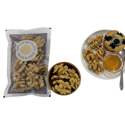 Premium Chilean walnuts (Akhrot) halves in sealed pack with walnuts in a wooden bowl and healthy serving platter.