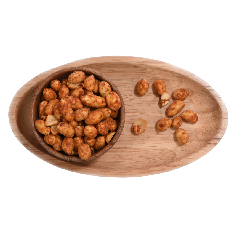 A bowl of chilli garlic peanuts on an elegant table setting, suggesting a perfect snack for social gatherings.