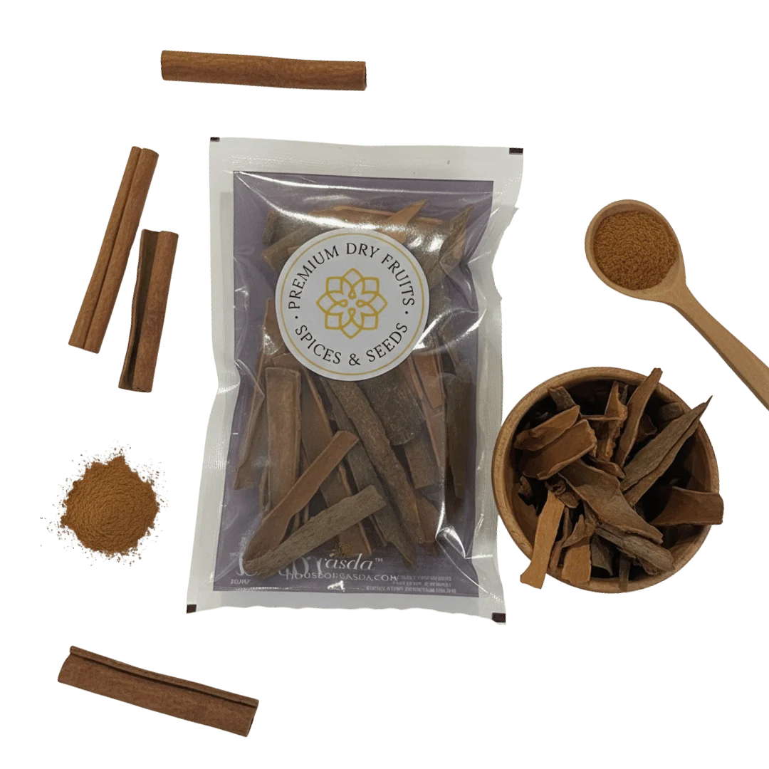 Cinnamon sticks with packaging and a wooden spoon on a white background