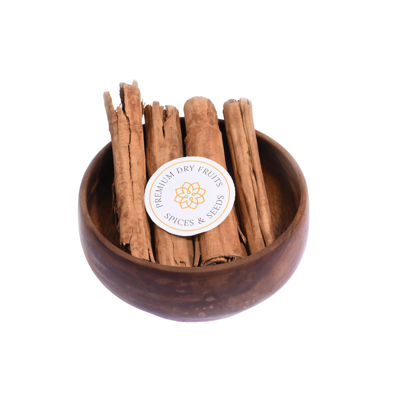 Cinnamon Quills Ceylon – premium whole cinnamon sticks placed in a wooden bowl, showcasing rich color and smooth texture