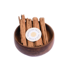 Cinnamon Quills Ceylon – premium whole cinnamon sticks placed in a wooden bowl, showcasing rich color and smooth texture