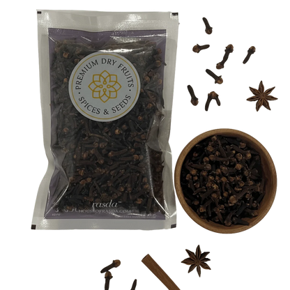 Premium whole cloves by Rasda with cloves in wooden bowl and spice elements on transparent background