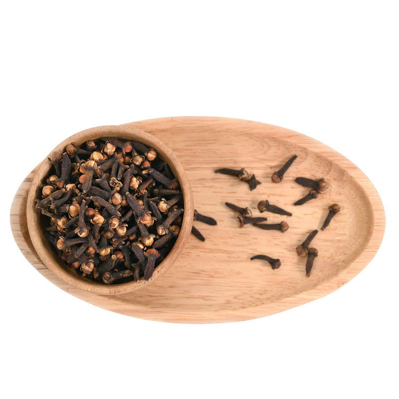 A wooden cup full of Cloves (Laung), highlighting their distinctive, nail-like shape and rich brown hue.