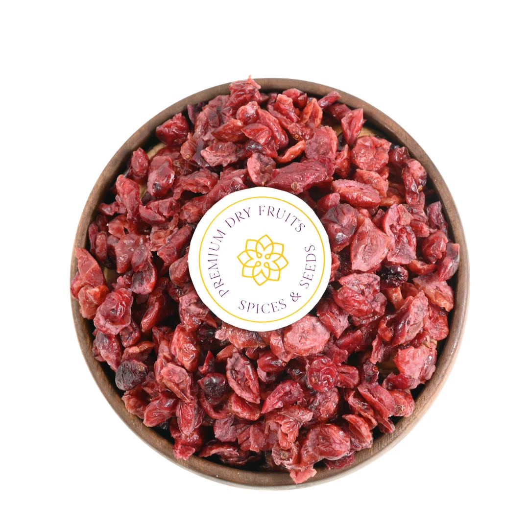 Close-up of Cranberries Dried Sliced Bright Red Soft & Moist, glistening with freshness and vibrant red color.