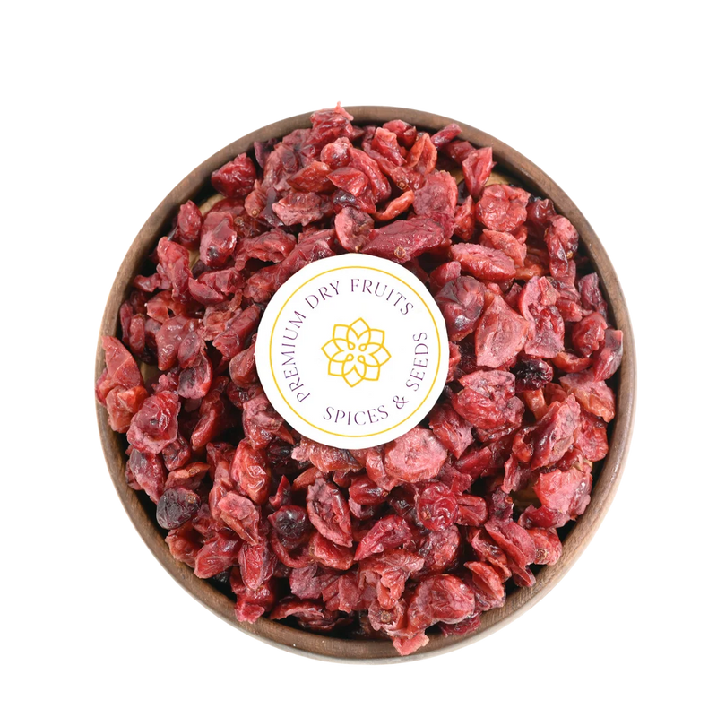 Close-up of Cranberries Dried Sliced Bright Red Soft & Moist, glistening with freshness and vibrant red color.