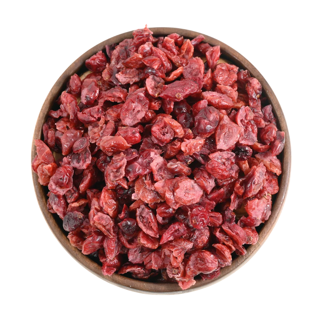 Cranberries Dried Sliced Bright Red Soft & Moist in a wooden bowl on a white background