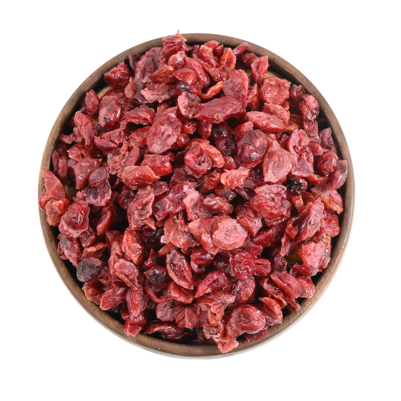 Cranberries Dried Sliced Bright Red Soft & Moist in a wooden bowl on a white background