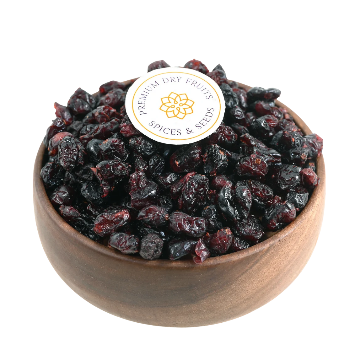 Premium whole dried cranberries in a wooden bowl, showcasing their deep red color and plump texture.