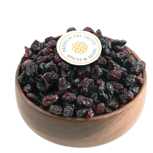 Premium whole dried cranberries in a wooden bowl, showcasing their deep red color and plump texture.