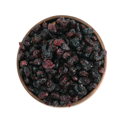 Rich red dried cranberries displayed in a round wooden bowl, emphasizing their premium quality and vibrant look.