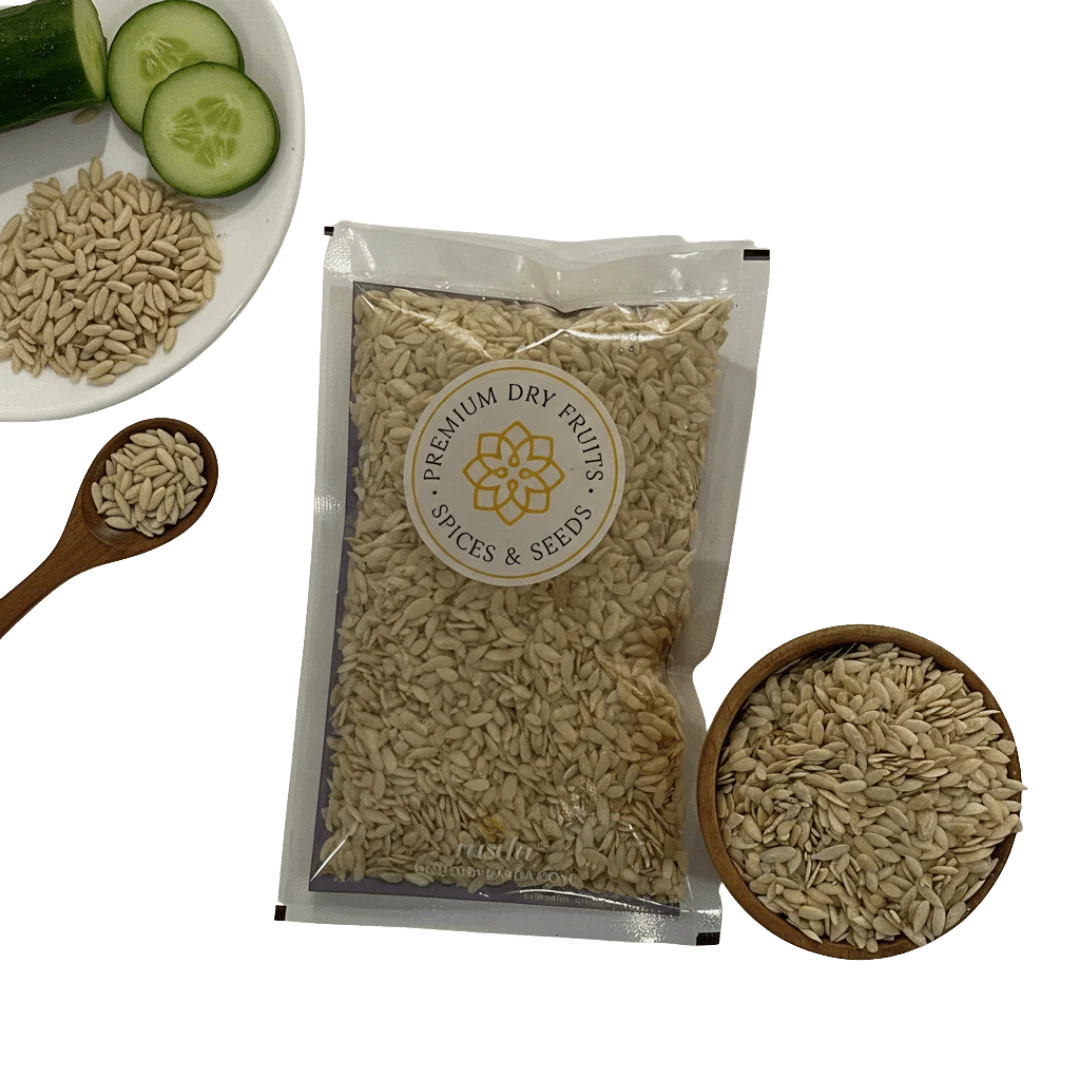 Packaged Cucumber Seeds with a brand logo, surrounded by cucumbers and a bowl of spices on a white background