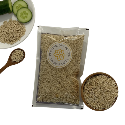 Packaged Cucumber Seeds with a brand logo, surrounded by cucumbers and a bowl of spices on a white background