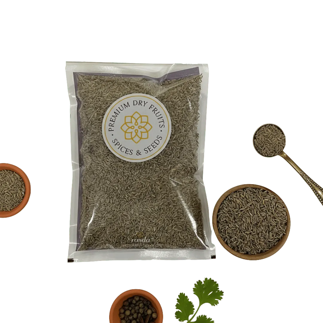 Packaged Cumin Seeds with a spoon and bowls on a white background