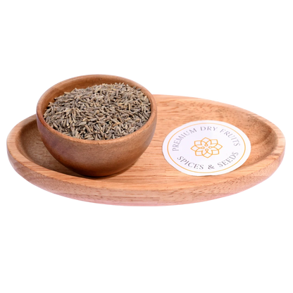 Cumin Seeds / Jeera in a wooden bowl showcase fresh, aromatic seeds for cooking.