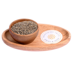 Cumin Seeds / Jeera in a wooden bowl showcase fresh, aromatic seeds for cooking.