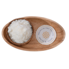 Fine white Desiccated Coconut Powder Nariyal Burada in a wooden bowl, showcasing its soft and fluffy texture.