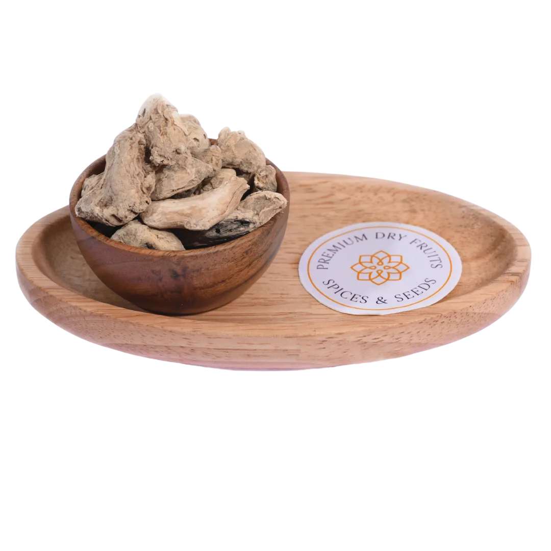 Dried Ginger or Sonth in a wooden bowl showcases premium-quality dried ginger slices.