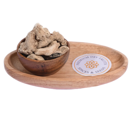 Dried Ginger or Sonth in a wooden bowl showcases premium-quality dried ginger slices.