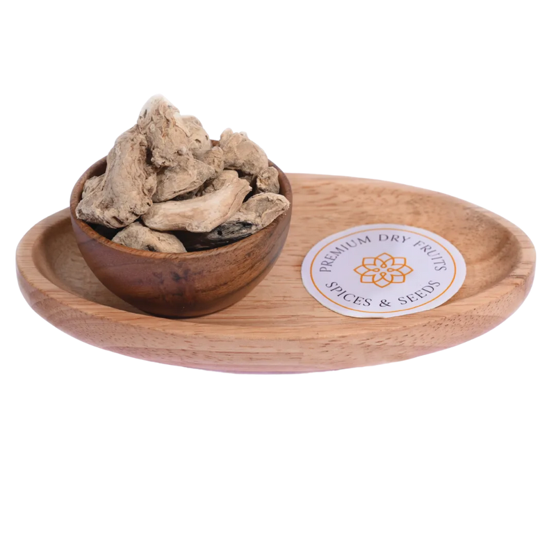 Dried Ginger / Sonth in a wooden bowl showcases premium-quality dried ginger slices.