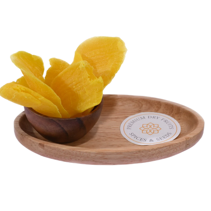 Bright yellow Dried Mango Slices in a wooden bowl, showing their soft, chewy texture and natural sweetness.