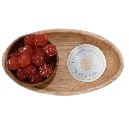 Dried Roseberry Plums neatly arranged in a wooden bowl, highlighting their glossy finish and delicious taste.