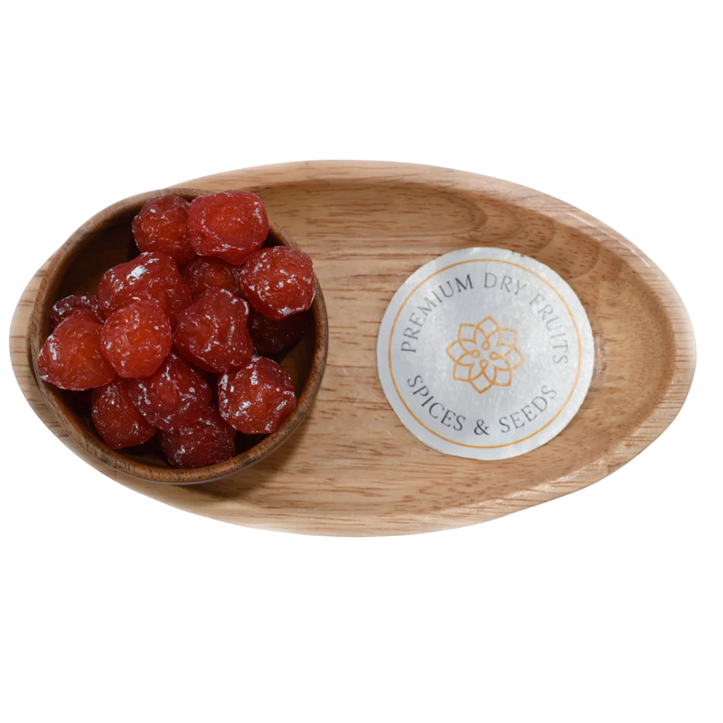 Dried Roseberry Plums neatly arranged in a wooden bowl, highlighting their glossy finish and delicious taste.