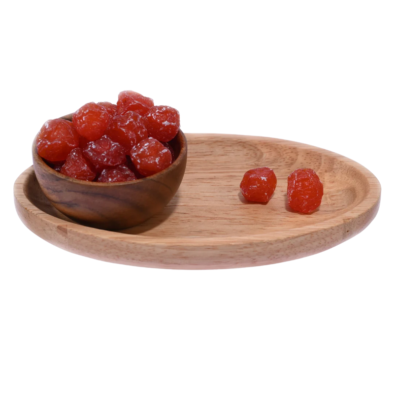 Premium Dried Roseberry Plums displayed in a rustic wooden bowl, showcasing their deep color and juicy texture.