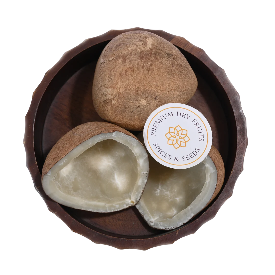 Close-up of Dry Coconut Halves / Copra, highlighting the firm coconut meat and textured outer shell.