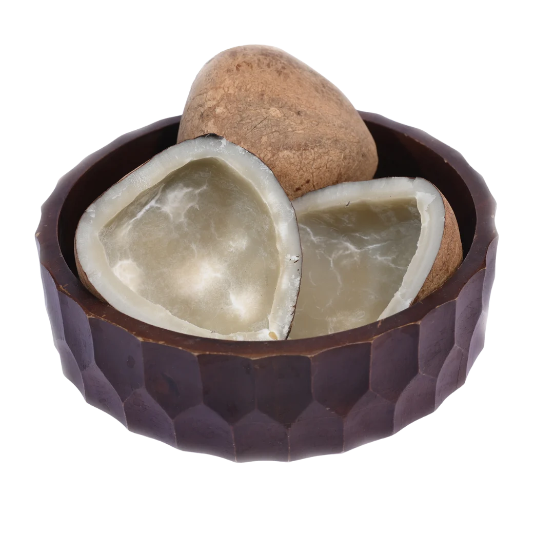 Premium quality Dry Coconut Halves / Copra arranged in a rustic wooden bowl, perfect for cooking or snacking.
