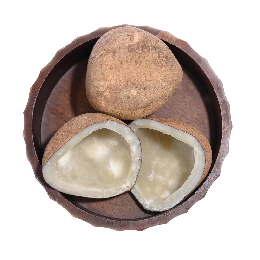 Fresh Dry Coconut Halves / Copra in a wooden bowl, showing natural color, texture, and organic appeal.