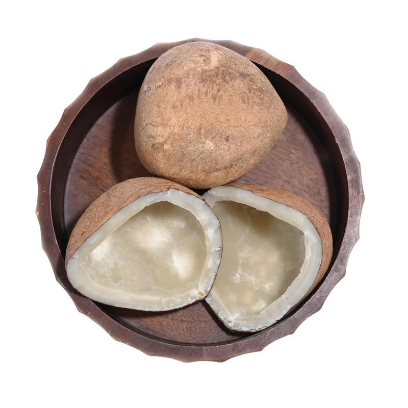 Fresh Dry Coconut Halves / Copra in a wooden bowl, showing natural color, texture, and organic appeal.