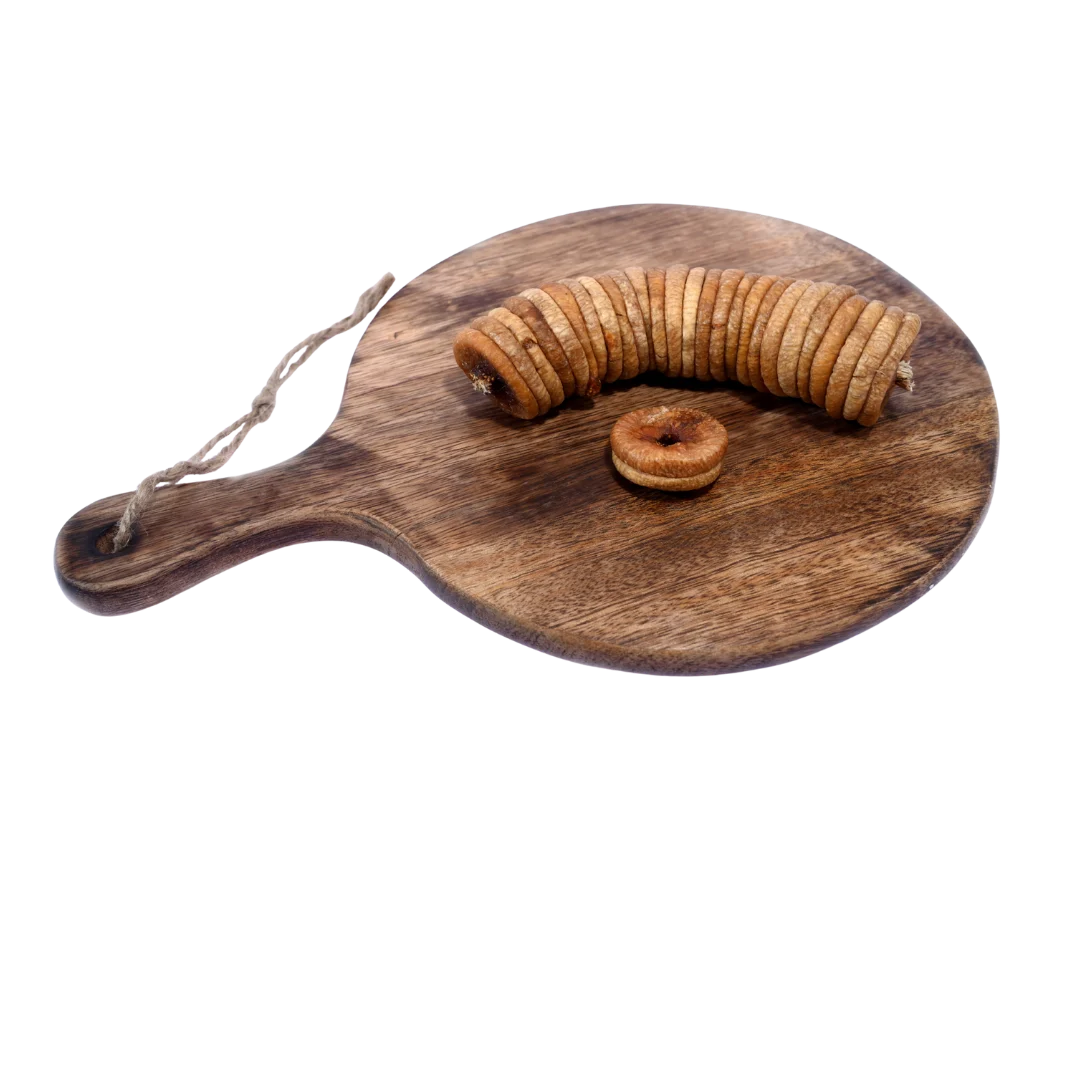 Dry Figs Choice Anjeer arranged neatly on a wooden surface, displaying their round shape and rich quality.