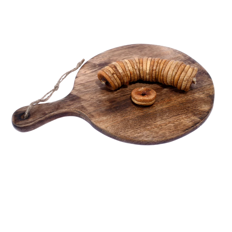 Dry Figs Choice Anjeer arranged neatly on a wooden surface, displaying their round shape and rich quality.