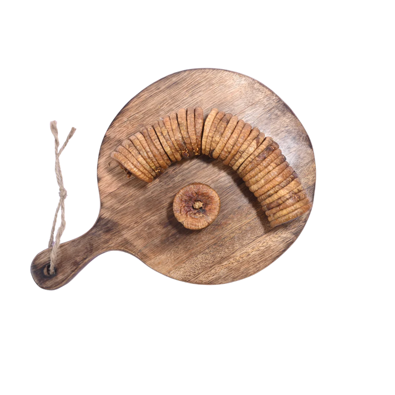 Dry Figs Standard Anjeer spread on a wooden surface, emphasizing quality and wholesome appearance.