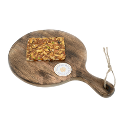 Dry fruit chikki is a popular Indian sweet made from a mix of nuts (such as almonds, cashews, and pistachios) and jaggery