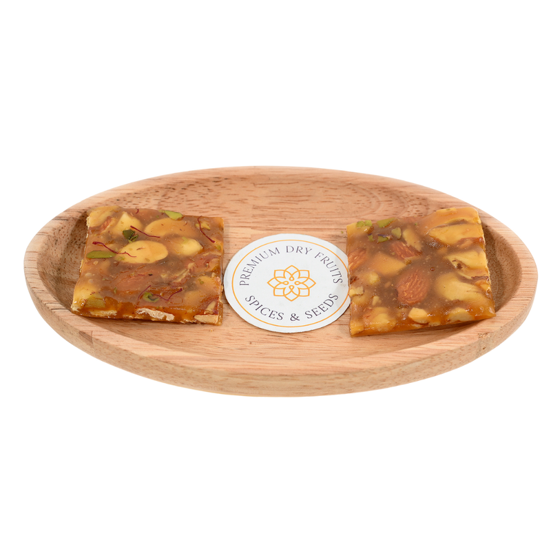 It is often enjoyed as a healthy snack due to its rich nutrient content and is free from preservatives and artificial colors Dry Fruit Chikki.