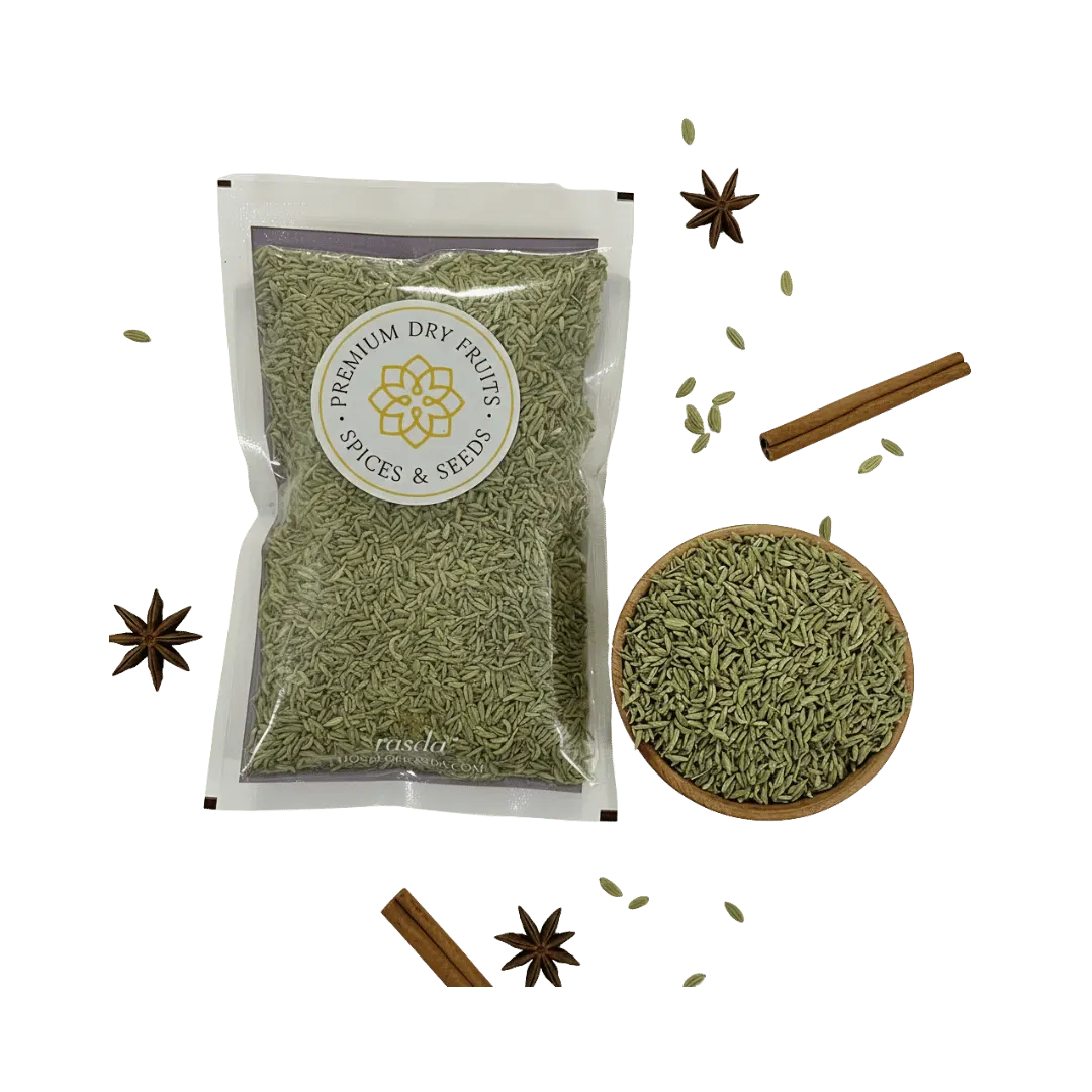 Packaged green fennel Lucknow with a bowl of spice and cinnamon sticks on a white background