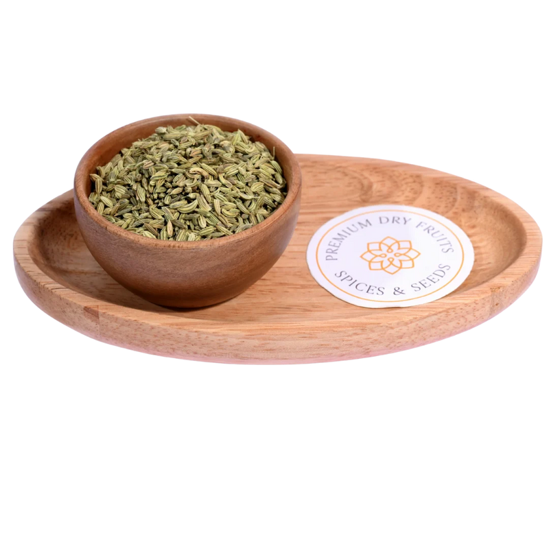 Fennel Seeds / Saunf in a wooden bowl showcase fresh, aromatic seeds for culinary use.