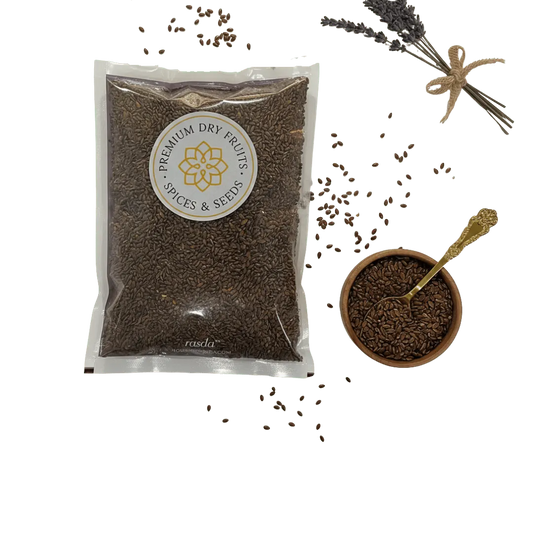 Packaged Flax Seeds (Alsi) – Roasted & Salted with a bowl of spices and a spoon on a white background