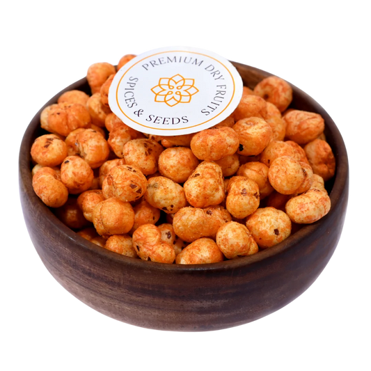 Crunchy and flavorful, Fox Nuts Fiery Peri Peri Spiced are roasted to perfection and coated with bold peri peri seasoning in a wooden bowl.