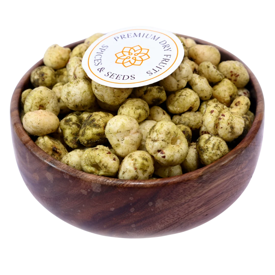 Fox Nuts Minty Pudina Makhana – Crispy roasted fox nuts coated with refreshing mint and pudina flavor, served in a wooden bowl.