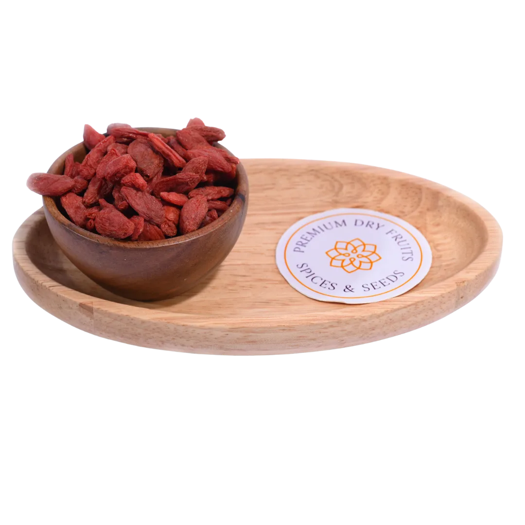 Goji Berries Dried in a wooden bowl showcasing their bright red-orange color and natural texture.