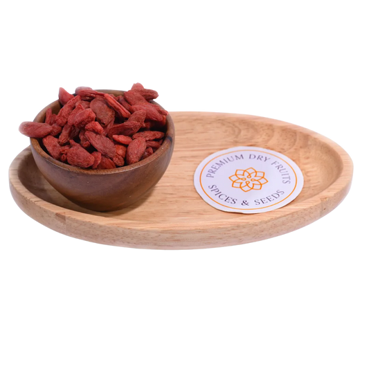 Goji Berries Dried in a wooden bowl showcasing their bright red-orange color and natural texture.