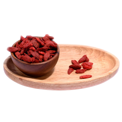 Goji Berries Dried displayed in a rustic wooden bowl emphasizing premium quality and freshness.