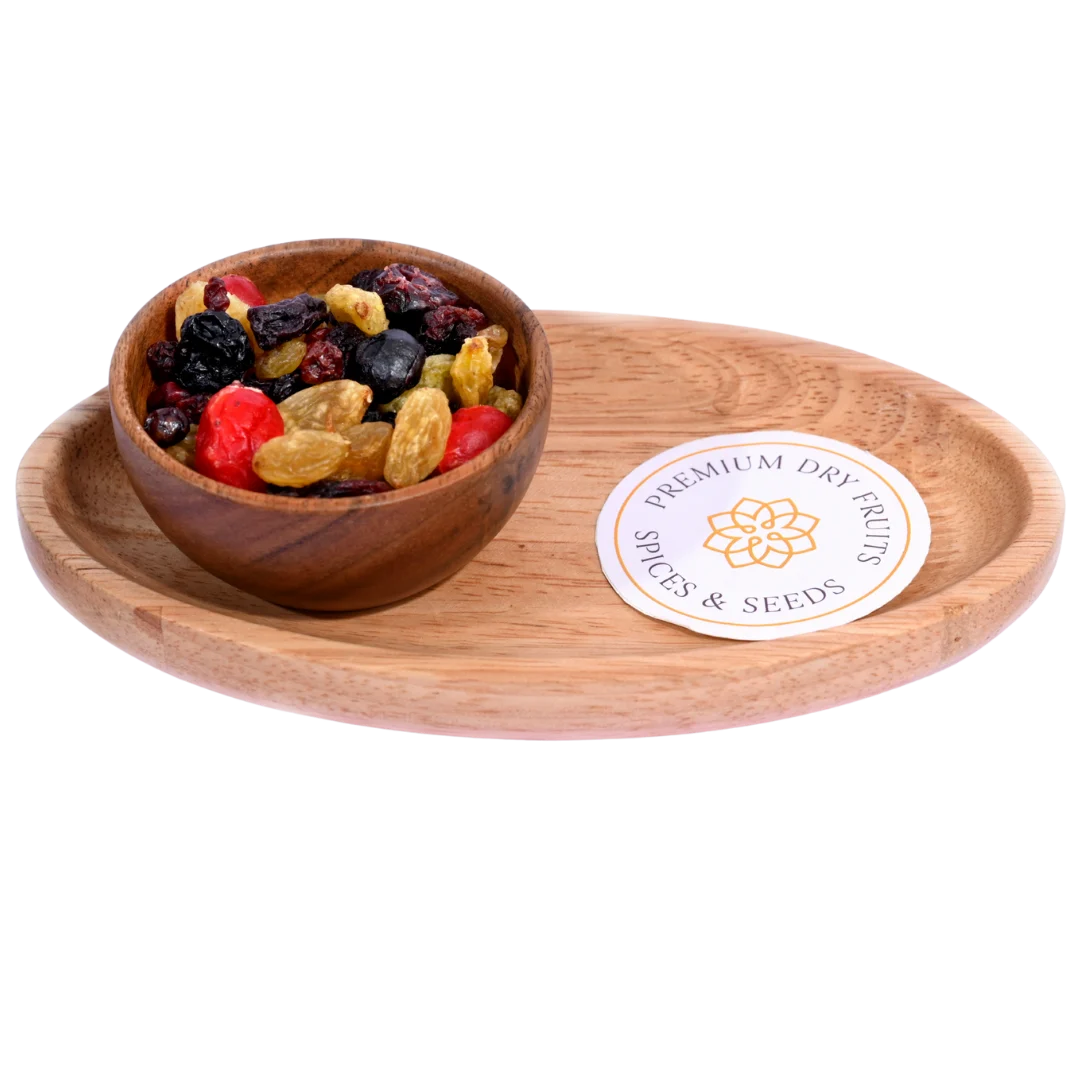 Golden Berry Trail Mix in a wooden bowl features a vibrant blend of berries, nuts, and seeds.