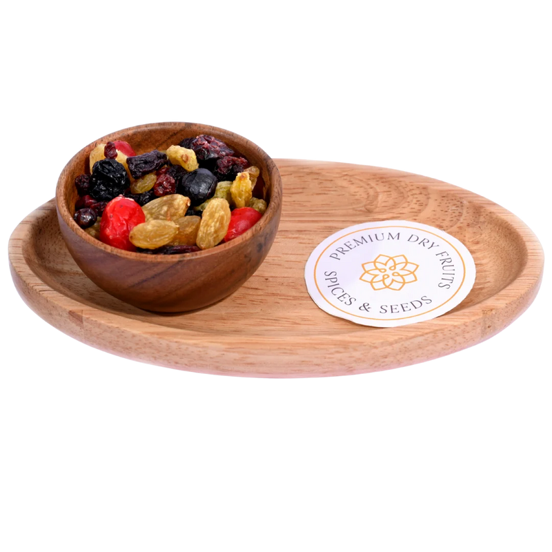 Golden Berry Trail Mix in a wooden bowl features a vibrant blend of berries, nuts, and seeds.