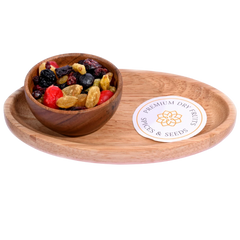 Golden Berry Trail Mix in a wooden bowl features a vibrant blend of berries, nuts, and seeds.